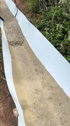 Isn't this the EASIEST way to move materials down a hill?! What would you use? #diyproject #hillside