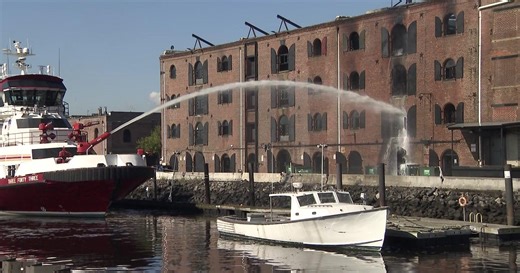 Firefighters still tackling hot spots a day after massive Red Hook, Brooklyn fire