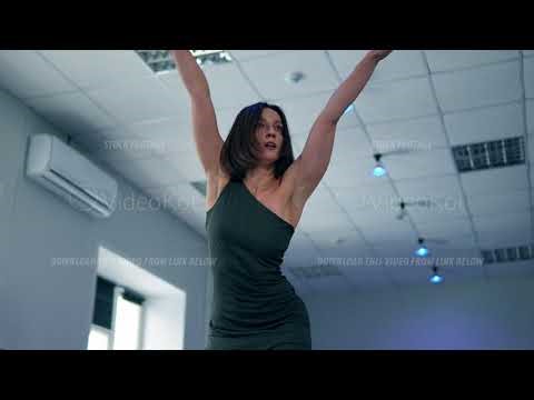 Professional female dancer is training new choreography in studio alone