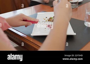 Two Young Italian Women Eating Sitting At The Table In The Kitchen At Home Stock Video Footage - Alamy