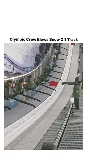 Rare Folio on Instagram: "It shows a synchronized team of workers using powerful leaf blowers (gas-powered backpack models) to clear fresh snow or ice from a bobsleigh, luge, or skeleton sliding track. Dozens of crew members line up in precise formation, blasting air in unison to "blow dry" the surface with massive lift and force—creating dramatic gusts, flying snow particles, and a satisfying whoosh of wind. The coordinated effort ensures the track is smooth and safe for high-speed runs, with a