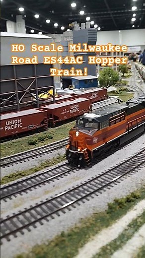 HO Scale Milwaukee Road ES44AC Hopper Train Passes Concrete Plant!