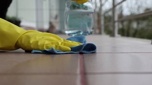 Woman cleaning tile floors outdoors, spring cleaning, 4k footage, home cleaning | Premium Stock Video Footage