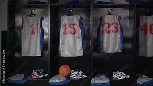 Basketball Changing room / Locker room. All the kit or uniform is laid out ready for the players. Camera dolly motion.