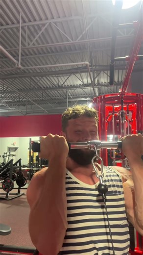 Cybex curls to absolute failure. Controlled reps build real arms.
