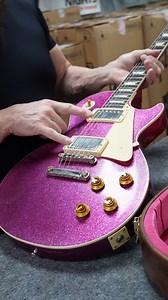 🎸✨ Check out this light-aged 1957 Les Paul with a unique pink sparkle finish, designed by us! Not your average guitar—this beauty features unpotted Custombucker Alnico III pickups, lightweight tailpiece, and a stunning checking pattern that shows off its vintage charm. Ready to make this rare gem yours? 🔥💥 📍Available now at Bizarre Guitar in Reno, NV. DM us for details or head to our website! #GuitarGoals #LesPaul #VintageVibes #CustomGuitar #RenoNevada #PinkSparkle #GuitarCollector #Bizarre