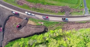 Road Construction; Time lapse aerial view of trucks and heavy machines stripping away old road surface, pavement, milling,recycling.