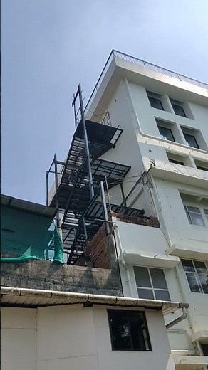 Building exterior fire escape stairs for emergency. Mild Steel Fire Exit Staircase