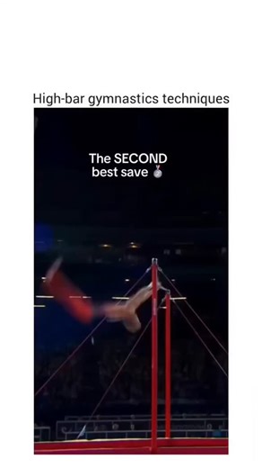 KnoWLedge.VErse.. on Instagram: "The video captures a high-intensity gymnastics session on the parallel bars, showcasing the precision and strength required in elite-level performance. At 00:08, a gymnast in an orange and white uniform executes a dynamic release move, letting go of the bar and catching it again mid-air, an action that generates a force of 600lbs—evident from the visible strain on the apparatus and the reactions of those nearby. His teammate and coach are seen reacting with surpr
