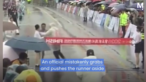 Race official error injures marathon leader at the finish line