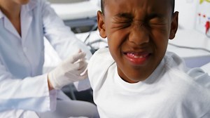 Doctor giving an injection to a boy Free Stock Video Footage