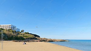 A Canadair firefighting aircraft over Eloro beach at Noto, Sicily in 4K