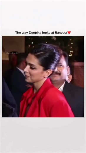 This image features Deepika Padukone in a striking red tailored blazer, showcasing her signature ble