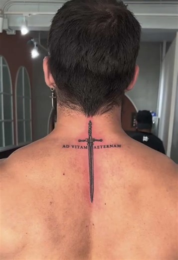 Bold Back Tattoo Design Featuring Majestic Sword