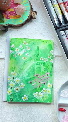 Paint with me Let's bring a dreamy spring garden to life on blank paper!All you need: watercolor paint, acrylic paint, and simple cotton q-tips. Easy painting tutorial step by step: Lay down a soft base with green watercolor • Cover with plastic wrap to create beautiful texture - Wait for the watercolor to dry, then peel off the wrap Dip cotton q-tips in acrylic paint to dot lovely blooming flowers So simple but super dreamy! Would you try this q-tip spring garden painting? #Meeden #Watercolor #