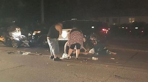 Richfield police squad car hits motorcycle, injuring 2 people