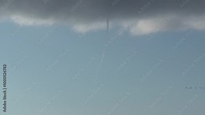 A vertical pan shows the formation of a waterspout, as the column begins to take shape between the clouds and the ocean surface. Captured during the early stage of the vortex forming. Check my portfol
