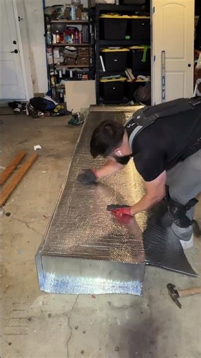 Installing an air conditioning duct that will feed the upstairs of this home. I used bubble wrap. ￼