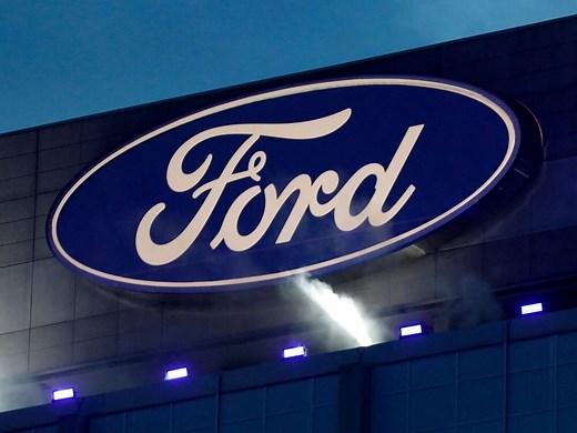 Ford cuts bonuses for half of middle management