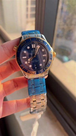 Omega Seamaster 300 Two-Tone Blue 42mm steel/18K gold, gradient blue ceramic dial, Master Chronometer Cal.8800. Luxury meets performance!#OmegaSeamaster300 #TwoToneBlue #MasterChronometer #DiveWatch #LuxurySportsWatch