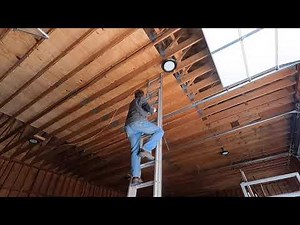 Installing 200 watt LED high bay lights in the barn