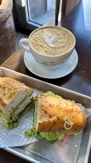 Our Asiago Smoked Turkey Sandwich is the perfect choice for all the ghouls and goblins looking for a quick and healthy lunch! Made with smoked turkey, slow-roasted tomatoes, pickled red onion, smashed avocado, spinach, and mustard aioli on an Ibis asiago hoagie bun, this sandwich will keep you energized for all your hauntings this afternoon 👻 | the filling station