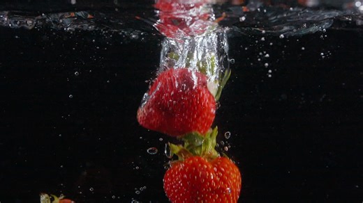 Slow Motion Fresh Beautiful Strawberries Drop in Water with Bubbles | Premium Stock Video Footage