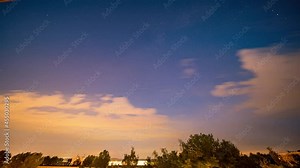 Time lapse of the starry night sky. The sky over the city night and day time-lapse