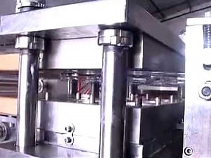 Machine for making plastic lids