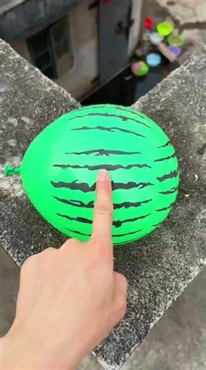 Experiment: Will a water balloon explode if it rolls down from a tall building? 💥🎈 #balloon