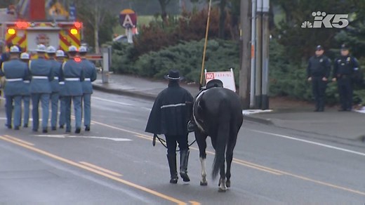 KING 5 - The riderless horse accompanies the funeral...