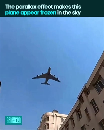 Ever seen a plane just hanging in the air? That is the parallax effect! It occurs when distant objects appear to move slower than nearby ones. While buildings fly past your window, a far-off airplane looks stuck. Since the camera and plane move in opposite directions, the plane's angular speed seems tiny. Your brain gets confused by using closer objects as a reference point. This same logic helps video games look 3D and even lets astronomers measure stars. It is not a glitch, just smart physics.