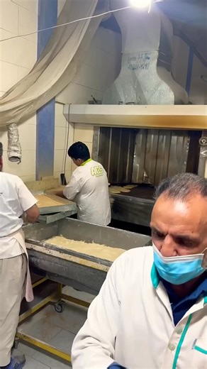 Right in the heat of the action! Watching the traditional flatbread bake to perfection in this incredible oven. #traditionaloven #bakerylife #freshbread #hotfood #flatbread #bakingprocess | This Bakery I