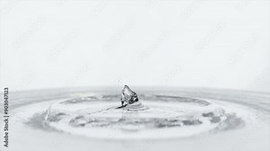 3d droplet falling on water surface creating splashes in slow motion