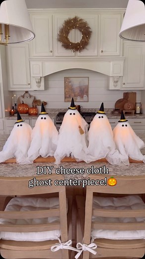 Morgan Winton on Instagram: "DIY cheese cloth ghost centerpiece! 🎃👻Comment GHOST and I’ll send you links to everything! These are so simple to make and sooo cute! I started with some candle sticks. Then I added a candle on top, added a styrofoam ball on the candle, draped a cheese cloth over the top and then stuck on some circle stickers for their eyes! I finished with a cute little witch hat on each one and a broom to the tallest one! #diyhomedecor #diydecor #falldecorations #diyfalldecor #fa