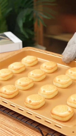 Moon Cakes 🥰 dough preparation take a bowl egg yolks 2 sugar 36g water 30ml vegetable oil 72ml mix well for 2min milk powder 18g white bean paste 38g to make bean pasta boil beans and put in a food processor baking powder 1.5g mix well for 2min cornstarch 16g cake flour 180g knead the dough refrigerator for 30min clean sweet dates 300g make balls each ball 11g take the dough make balls each ball 15g make the cakes moon cakes mold use any shape you want Bake in a preheated oven 190°C (top) and 1