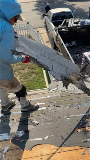 This is how roofers pull off old shingles during tear-off! 💪 #roofing #construction