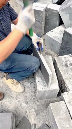 Splitting Heavy Stones Manually Using Steel Wedges for Professional Construction Tasks