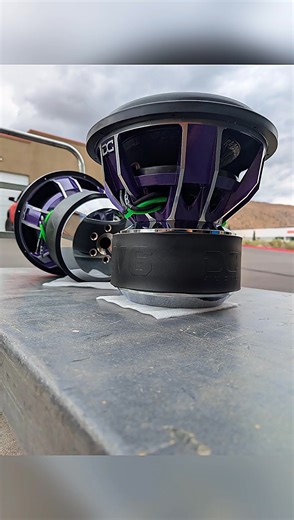 These 8 DC Audio LV6 15s in purple with green/black leads are on point!!! dcsounldab.com for your custom subs!!! | DC Audio