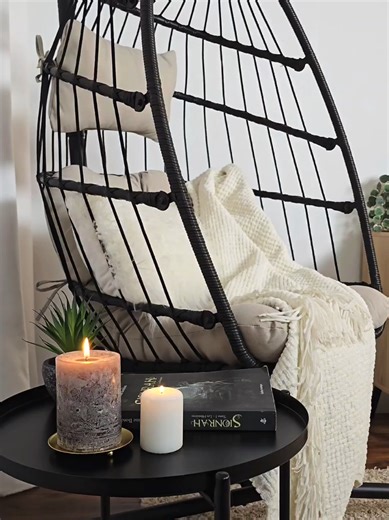 Creating a serene sanctuary at home can be achieved with a calm interior design. 🏡 Imagine yourself nestled in a comfortable, hanging egg chair, perfect for unwinding. 🥚✨ Accompany this with a good book and the soft glow of candles for a truly relaxing evening. 🕯️📖 This tranquil setup promises a wonderful escape from the everyday hustle. Embrace this peaceful ambiance for your personal time. 😌 #sanctuary #home #design #chair #book