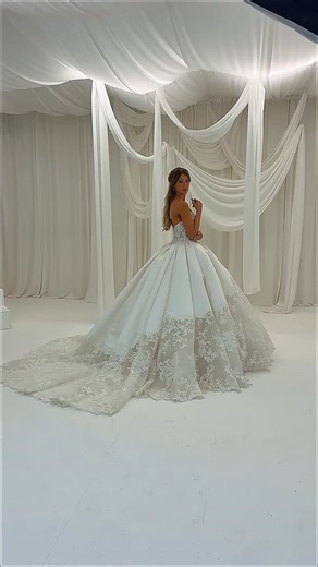 JUNE PEONY BRIDAL COUTURE Wedding Dress UK on Instagram: "Serafina C193 A dream spun in moonlight, lace and Mikado twined, The corset bodice gleams, with starlight softly lined. The skirt flows like cascading waves, a train of clouds behind, Where basque curves write a poem, and pleats hold vows enshrined. Layers of Mikado and lace, on silk so full and fair. Buttons down the back, like pearls on threads of song, Where different textures meet as mist and light belong. Time pauses here, in silhoue