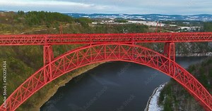 Aerial view winter landscape of Truyere river with Garabit Viaduct, French railway arched viaduct in Cantal department. Garabit Eiffel