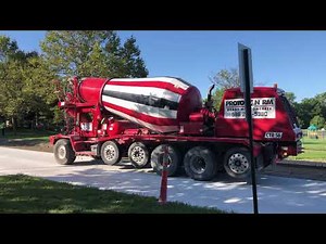 Spinning Concrete Trucks... two concrete trucks spinning their cement before pouring.