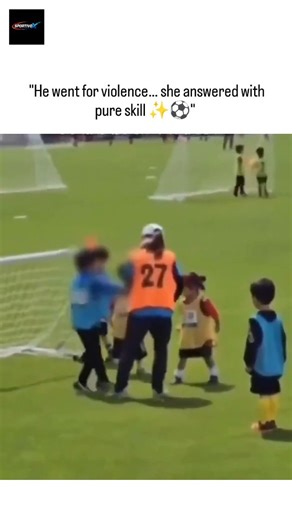 SPORTIVOX on Instagram: "The post features a 57-second video of young children playing football, where a boy fouls a skilled girl by kicking her legs, but she quickly recovers and dribbles past him with impressive control, earning widespread praise for her talent. With over 22,000 likes and 847,000 views in three days, replies predominantly celebrate the girl's poise and call for the boy's expulsion to address early aggression, reflecting broader discussions on bullying in youth sports. This cli