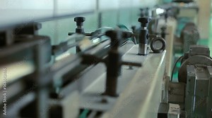 Industrial factory manufacturing machinery. Close up of conveyor line at factory. Factory manufacturing line. Industry manufacturing process. Production factory conveyor belt. Manufacturing equipment