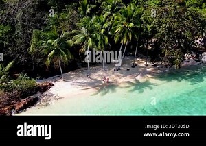 Relax on the stunning beaches of Koh Wai Island, Thailand. Enjoy the sun shining on turquoise waters, lush greenery, and the peaceful atmosphere perfect for a holiday escape Stock Video Footage - Alamy