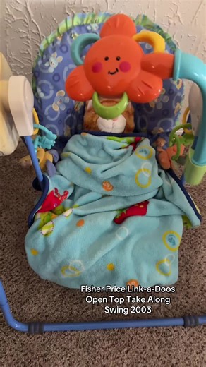 Explore the 2003 Fisher Price Link-a-Doos Swing