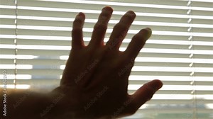 Blinding sun in the morning through roller blind