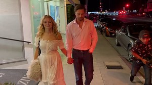 Heather Graham holding hands with John de Neufville on date