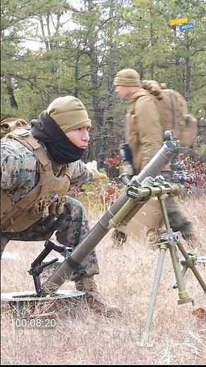 US Marine Corps mortarman conduct live fire exercises